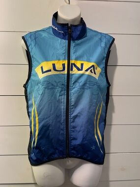 SUGOI blue cycling shell with yellow accents